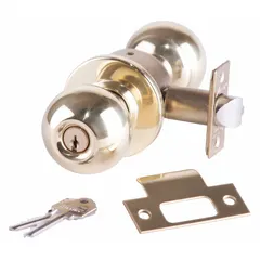 This storeroom knob lockset features a ball-style brass construction with an interchangeable core and ADA compliance. Designed for interior doors requiring keyed entry from outside and free egress from inside, it is commonly used in commercial facilities such as offices, schools, and hospitals.