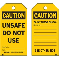Black caution tags with cable tie fasteners, supplied in packs of 10. Each tag provides space for signed-by and date entries. Used to mark equipment or areas requiring caution, do-not-use, or do-not-remove notices in industrial lockout/tagout procedures.