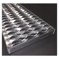 This steel stair tread features a serrated surface for slip resistance. It is used as a step component on industrial stairways, platforms, and walkways in facilities such as plants and warehouses