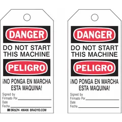 White polyester tags printed with black and red bilingual 'Danger/Peligro Do Not Start This Machine' text and a signed-by/date field. Each pack contains 10 tags with cable tie fasteners for attachment. Used for lockout/tagout during cleaning and maintenance to warn against accidental machine startup.