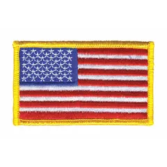 This embroidered patch features a U.S. Flag motif in gold on a plastic base. It measures 3 3/8 inches by 2 inches and is designed for sew-on attachment. Commonly used for uniform customization, gear identification, or commemorative purposes.