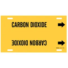 Yellow strap-on pipe marker with black legend reading 'Carbon Dioxide'. Fits pipe outer diameters from 8 to 9-7/8 inches. Includes directional arrows. Supplied as a single marker for identifying carbon dioxide lines in industrial piping systems.