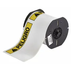 White vinyl label roll with PELIGRO header, 4 in x 6 1/4 in, 175 labels per roll. Acrylic adhesive. Compatible with Brady S3100 printer series. Used for hazard identification on pipes, equipment, and safety barriers in industrial facilities.