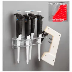 Wall-mounted pipette holder made of clear PETG. Overall height 15 7/8 in, length 3 5/8 in. Accommodates a pipette aid. Used for organizing pipettes in laboratory workspaces.