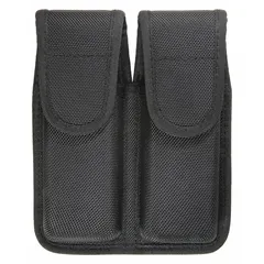 This duty equipment pouch is constructed from black ballistic nylon and measures 6 1/2 inches by 1 5/8 inches. It features a snap closure for secure retention. Designed for carrying spare magazines, it is suitable for use by law enforcement, security, and tactical personnel.