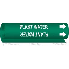 Green wrap-around pipe marker with white legend reading 'Plant Water' and directional arrows. Fits pipe outer diameters from 2-1/2 to 7-7/8 inches. Used to identify pipes carrying plant water in industrial facilities, aiding in quick recognition of pipe contents and flow direction.