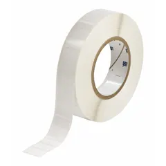 Thermal transfer precut label roll measuring 1/2 in x 1 in. Features a rubber, aggressive adhesive for permanent bonding to challenging surfaces. Halogen-free material suitable for environments with compliance requirements. Compatible with THT printer series for industrial identification and labeling.