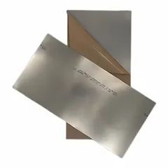 This shim stock sheet is made of 18-8 stainless steel, plain, full hard, with a silver finish. It measures 0.001 inch thick, 8 inches wide, and 12 inches long. Width and length tolerances are +/-0.075 inch; thickness tolerance is +/-10%. Used for precision alignment, gap filling, and leveling in industrial machinery, motors, and pumps.