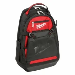 This ballistic nylon tool backpack in black/red measures 15 7/16 in W x 9 in D x 24 1/4 in H. It is impact-resistant and designed for carrying tools and equipment on job sites, providing a hands-free carry solution for professionals.