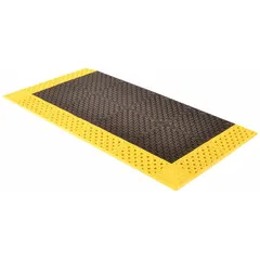 This standard drainage mat features a diamond tread pattern in black with a yellow border. Made of PVC and measuring 42 inches by 8 feet with a 7/8-inch thickness, it is non-reversible. Suitable for wet areas where fluid drainage and slip resistance are required, such as industrial floors.
