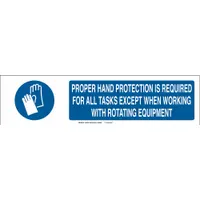 White polystyrene sign slider insert measuring 6 in x 23-7/8 in with blue legend text. Non-retroreflective, rated for indoor/outdoor use. Legend reads: 'Proper Hand Protection Is Required For All Tasks Except When Working With Rotating Equipment'. Used in industrial facilities to communicate mandatory hand protection rules in areas with rotating equipment